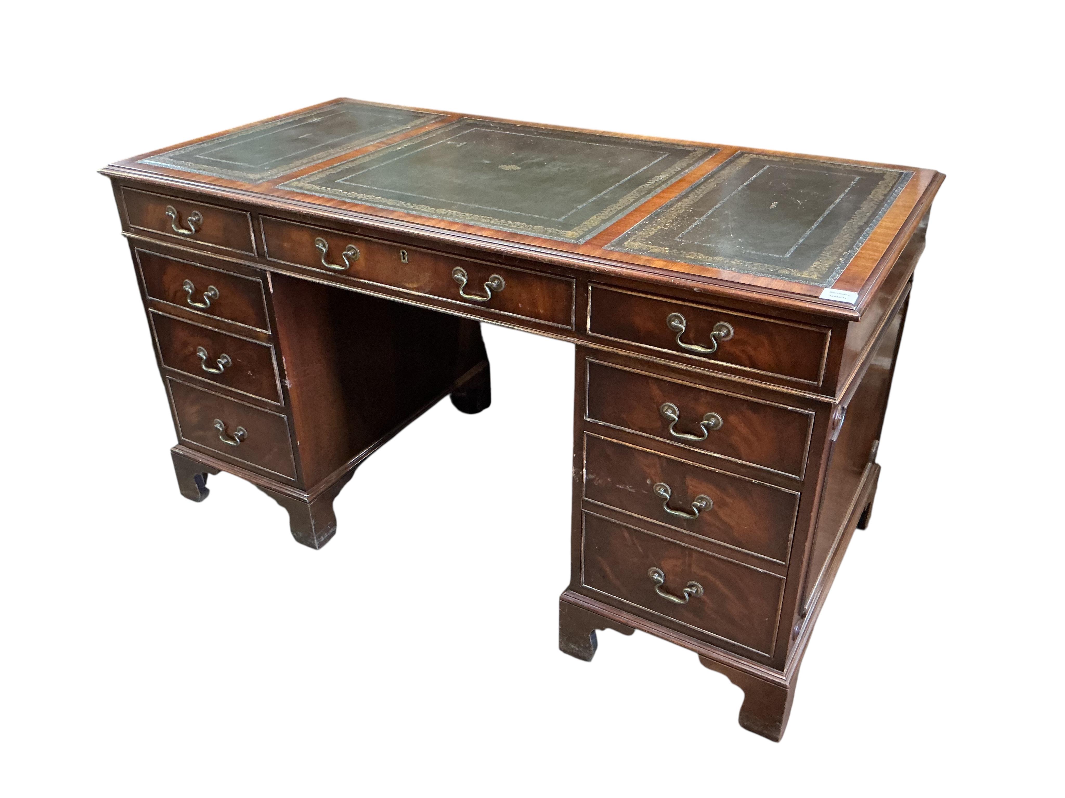 A reproduction mahogany pedestal desk, width 140cm, depth 68cm, height 76cm